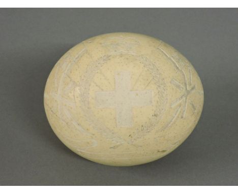 A carved ostrich egg, engraved with a cross within a laurel branch, inscribed 'Royal Army Medical Corps, South Africa'