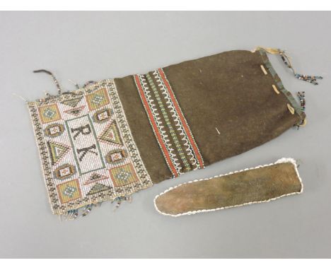 A Native American beaded bag, and a miniature bow and arrow
