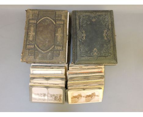 Two Edwardian photo albums, both missing music boxes, various portrait photos, and over one hundred stereoscopic cards, inclu
