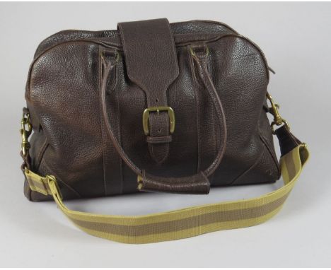 J & M Davidson rich brown calf leather holdall, with striped cotton lining, brass hardware and lock, with dust bag