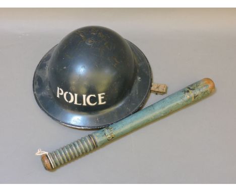 A WWII police tin helmet, together with a Victorian painted truncheon