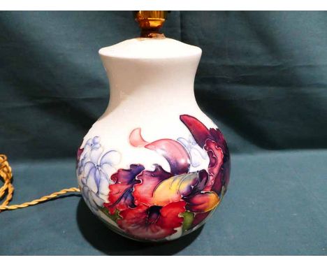 A Moorcroft pottery Table Lamp Base, tubeline decorated with Summer blooms on a cream ground, 20cm high (pot only) impressed 