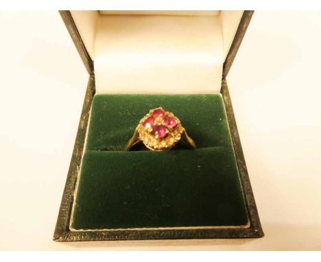 An 18ct gold ruby and cognac diamond cushion cluster ring size O, 4.2g