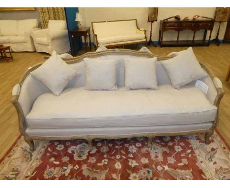 A modern French style show frame Sofa, raised shape back, upholstered elbow pads, oatmeal upholstery, seats three, with singl