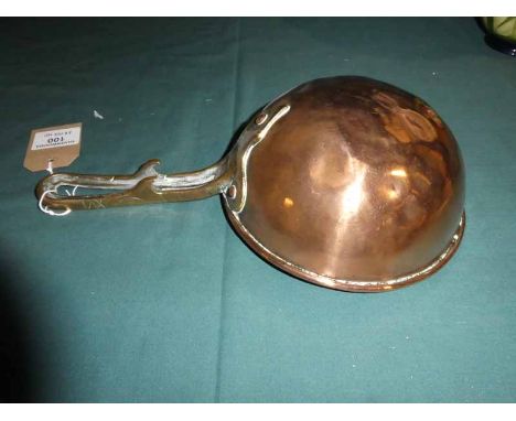 A 19th century copper Ladle, 20cm diameter with cast brass handle 