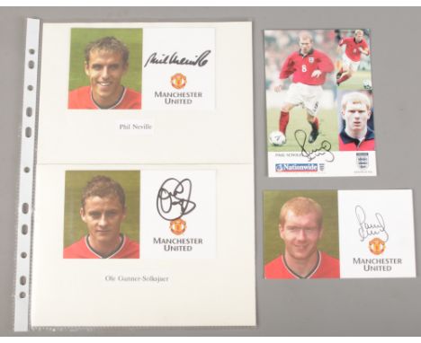 Four signed Manchester United FC football cards. Includes autographs Paul Scholes, Ole Gunnar-Solksjaer and Phil Neville.  