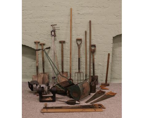 A collection of garden tools including shears, forks and hoes, together with a push-along Webb cylinder lawnmower and Wickes 