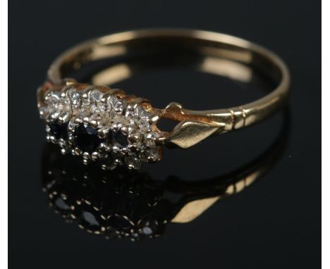 A 9ct gold cluster ring set with sapphires and diamonds.Ring size PWeight 1.5g  