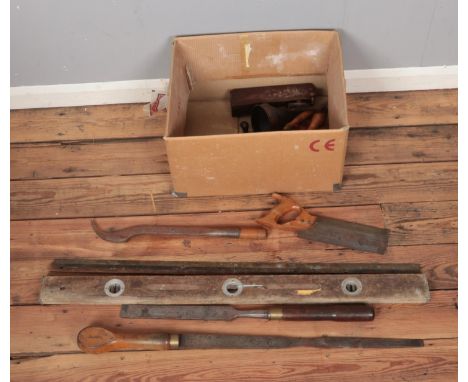 A box of assorted vintage tools including J. Wilkinson carriage screwdriver, sharpening stone, plane, saws, etc.  