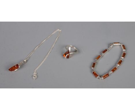 A collection of silver and amber jewellery. To include pendant on chain, bracelet and ring.  