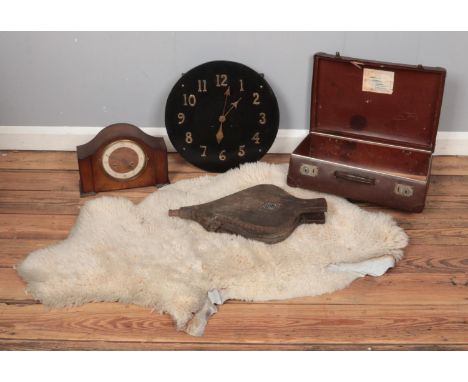 A small collection of assorted items, to include Perivale mantle clock, small Globetrotter suitcase, sheepskin rug and a pair