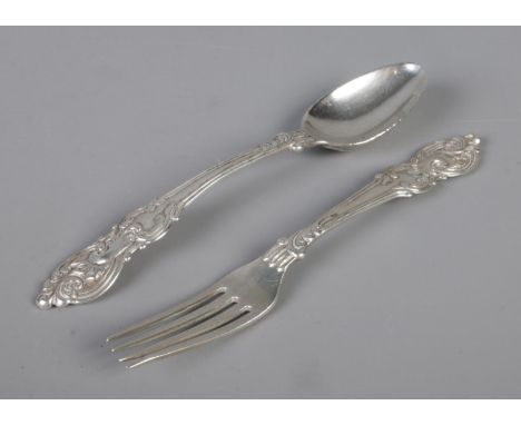 A matching Indian fork and spoon, with scrolled detailing to the finials. Assay marks to the reverse for H&amp;Co - Hamilton 