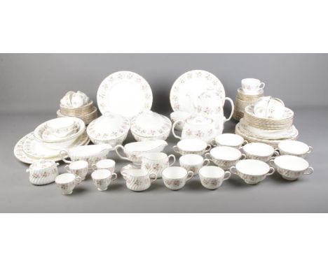 A Minton tea/dinner service in the Spring Bouquet pattern to include tea and coffee pots, tureens, soup cups, etc. Approx. 97
