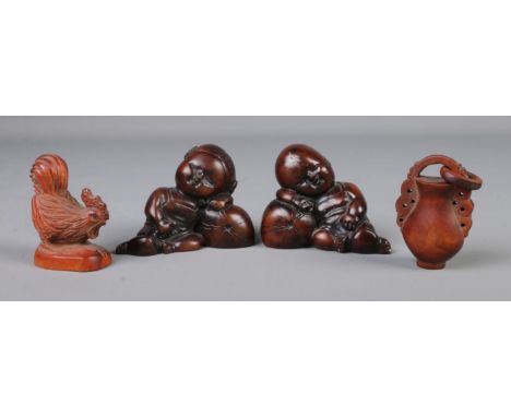 A collection of oriental figures including Japanese carved netsuke depicting a cockerel, a carved figure of a jug/pot and two