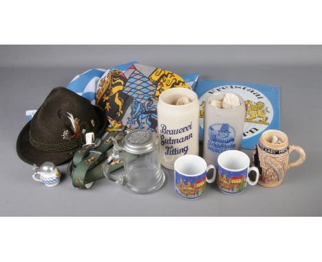 A quantity of German tourism pieces including enamel sign, flag, braces, various flagons and mugs.  