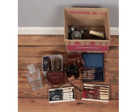 A box of assorted collectables to include glass decanter, costume jewellery brooches, Stratton Ship tie slide, Zeiss Ikon Net