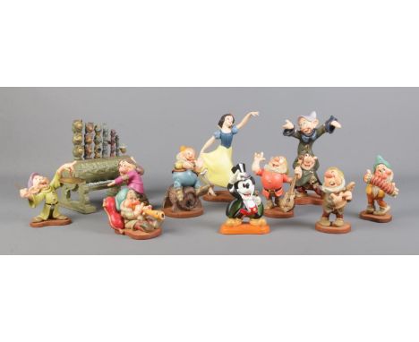 Ten boxed Snow White figurines, from the Walt Disney Classics Collection, together with 'On With The Show!' - From Magician M