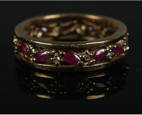 A 9ct gold ruby and diamond eternity ring. Size Q, 4.5g.  