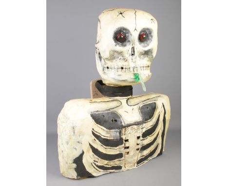 A paper mache model formed as a skeletons head and torso. (68cm)  