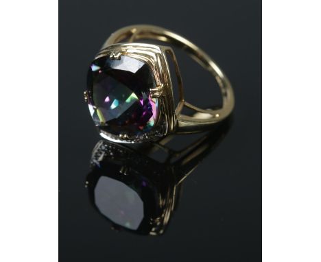 A 9ct gold mystic fire topaz dress ring on half illusion set border.Ring size NÂ½Weight 4g  