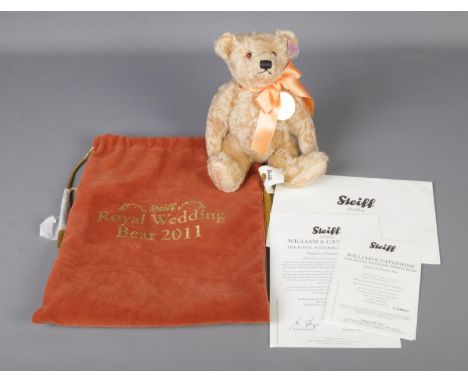 A Steiff William and Catherine Royal Wedding teddy bear with certificate of authenticity and original velvet carry bag.  