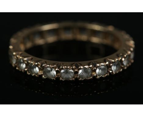 A 9ct gold synthetic spinel eternity ring. Size M, 1.9g.  