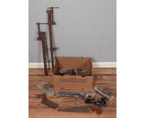 A box of tools. Includes Paramo Plainmaster plain, saws, screwdrivers, etc.  