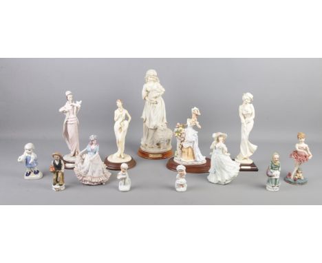 A collection of ceramic and resin figure groups, including examples from The Leonardo Collection, Giuseppe Armani and Regency