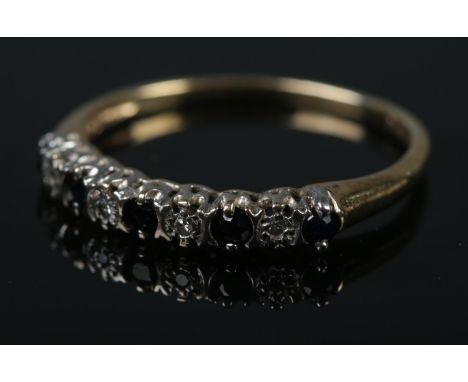 A 9ct gold half eternity ring set with diamonds and sapphires.Ring Size LÂ½Weight 1.1g  