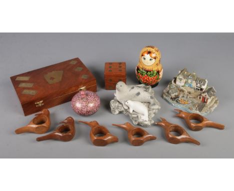 A collection of wooden and ceramic items. Includes Danbury Mint Safely Home, Wooden games sets, Russian doll etc.  