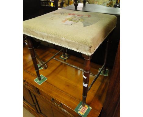 A Regency mahogany stool with tapestry seat.