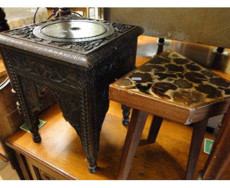 An Eastern carved hardwood stool and an African indigenous bushveld wood stool by Weatherwoods R. S. A.