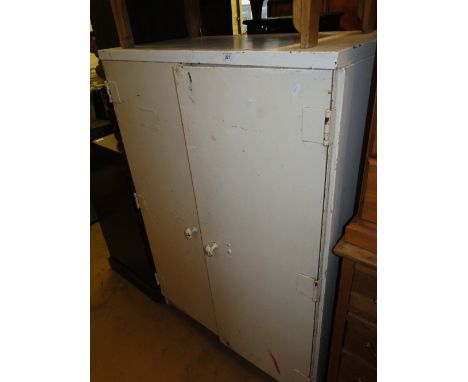 A Vintage industrial painted metal 2-door cupboard with fitted shelves.