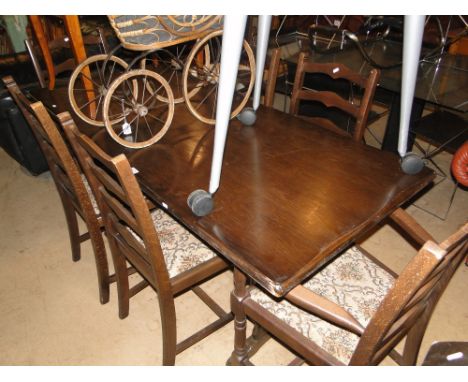 A oak refectory dining table together with a set of 6 ladder back chairs, (4+2).