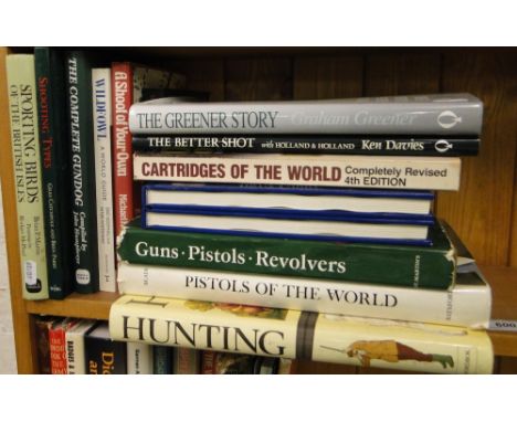 Shelf of books on shooting, & weapons