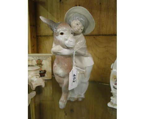 A Lladro boy with donkey.
