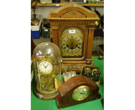 An oak bracket clock, a torsion clock, another clock & a movement for restoration