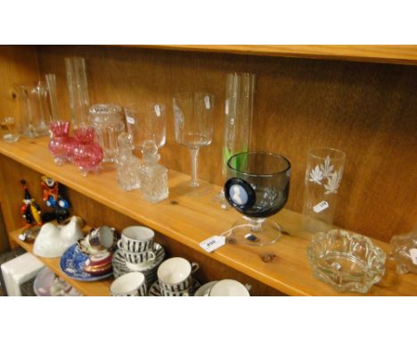 A shelf of glass vases, scent flasks and stoppers, etc.