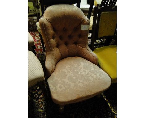 A small Victorian button back upholstered nursing chair.