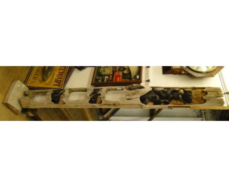 South East Asian carved tree trunk section with design of elephants