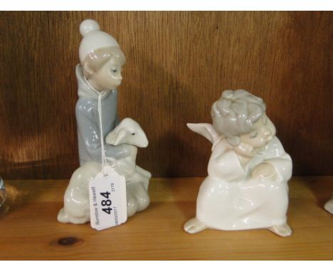 Lladro boy with lamb and a Lladro Cupid.