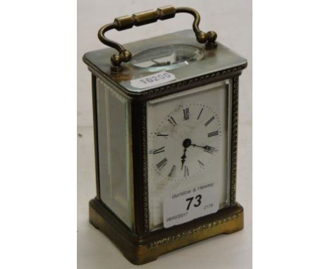 A brass cased carriage clock.