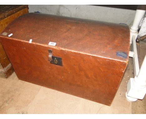 A stained pine domed top trunk.