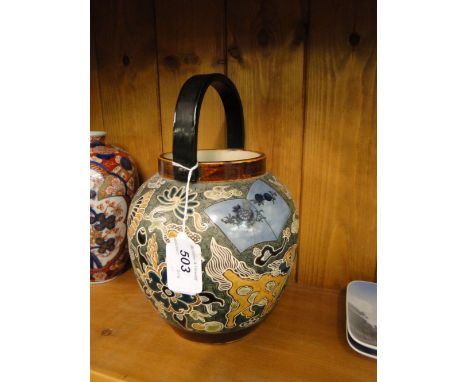 A Japanese ceramic biscuit barrel circa 1900,decorated with exotic birds, signed under base, height excluding handle 6.5".