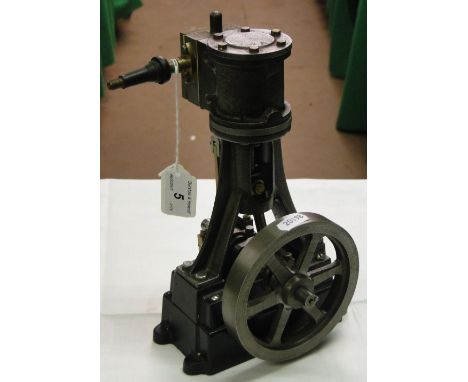 A cast-iron and brass stationary engine.