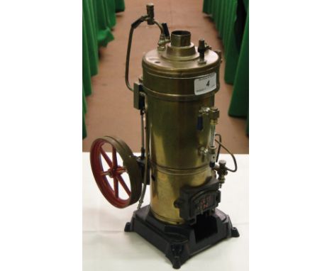 A brass Bing stationary steam engine.