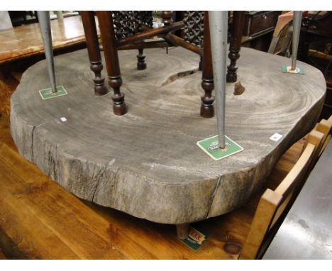 A large tree trunk occasional table, width 3'10".