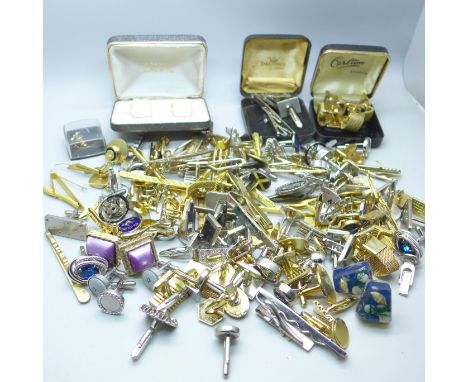 A large collection of cufflinks and tie-pins 