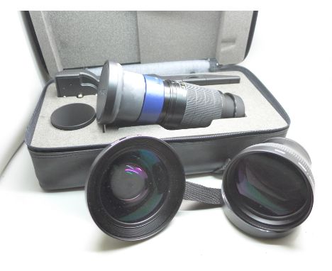 A boxed Olympus Tele Extension Lens Pro TCON-300S, together with two other Olympus camera lenses