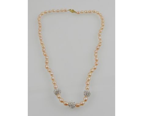 A South Sea pink pearl necklace, with 14 carat yellow gold clasp. 